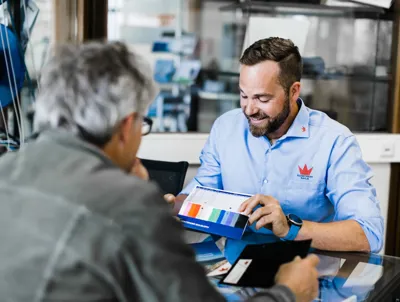 sailmaker giving advice on spinnaker cloths